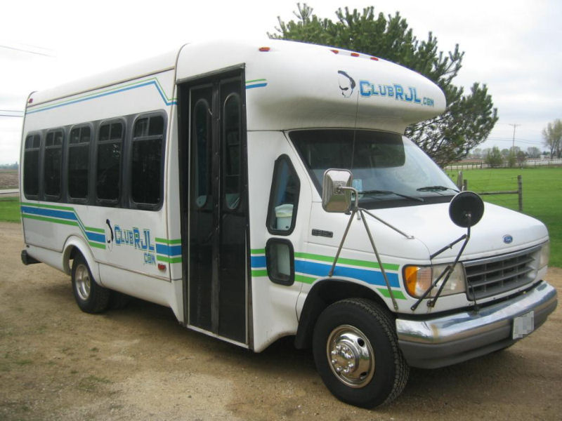 Club RJL party bus exterior with custom Club RJL graphics